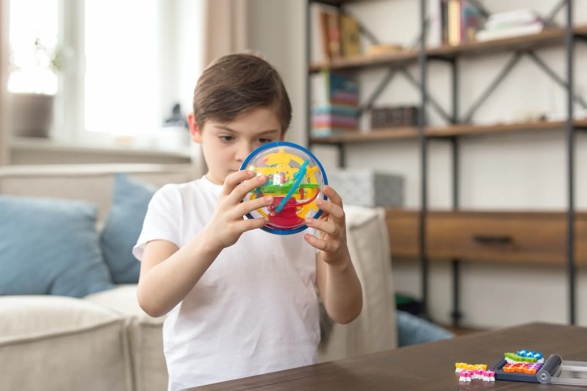 boy-playing-with-colorful-toy-at-home-2026-03-09-22-06-18-utc.webp